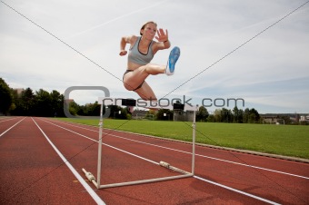 Jumping over a hurdle
