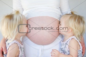 Girls Kissing Mom's Belly
