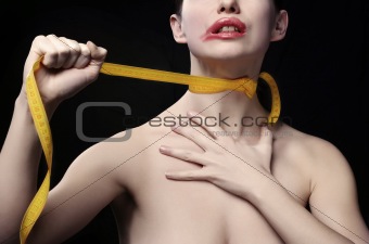 Young woman throttle herself by tape-line