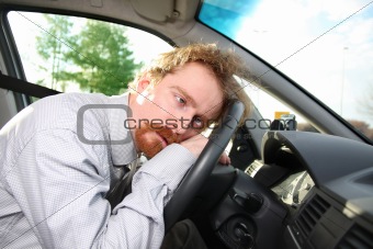 driver sleeps in a car