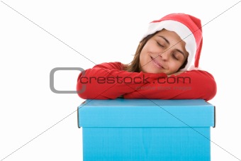 santa woman sleeping on top of christmas present box