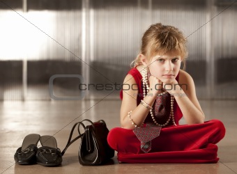 Sullen young girl in red