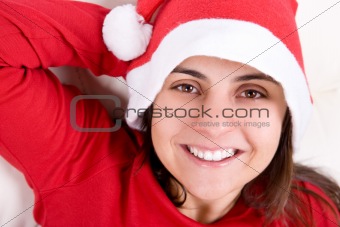beautiful young woman with red christmas hat portrait