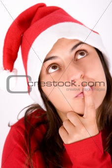young girl with christmas red hat thinking