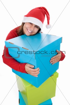 Young santa woman holding giant blue present box