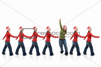 group of santa claus women in line with one breaking the pattern