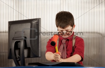 Nerdy boy smashing his computer