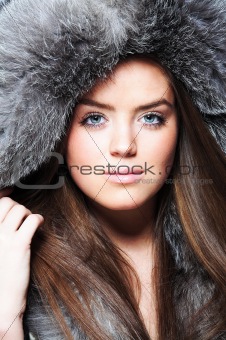 Beautiful girl wearing furs