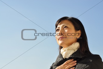 young woman looks on the sky