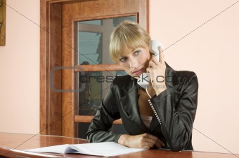 blond receptionist at phone