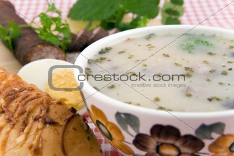 sour soup with egg, sausage and bread