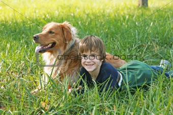 Boy Laying Down with Dog