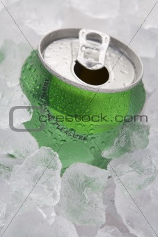 Green Can Of Fizzy Soft Drink Set In Ice With The Ring Pulled