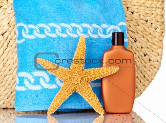 Straw Beach Bag, Blue Towel, Sunscreen and Starfish