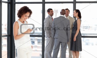Business woman sending a text message