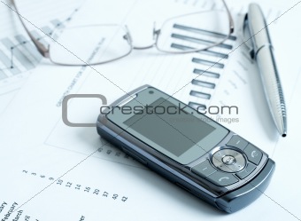 Cellphone with pen and glasses