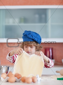 Young boy baking in the kitchen 