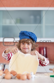 Young boy baking in the kitchen 