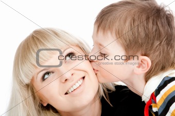 Boy kissing mother