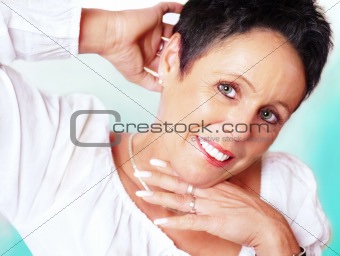 Mature woman portrait on mint background