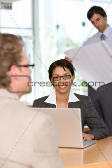 businesswoman talking to client