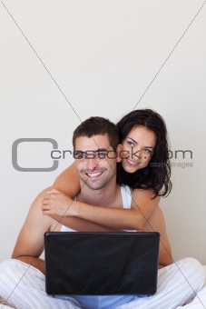 Couple using a laptop together