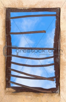 Old window closed by rusty lattice
