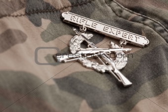 Rifle Expert War Medal on a Camouflage Material.