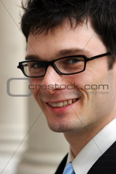 Happy businessman wearing glasses
