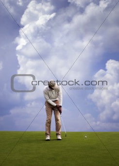 Man playing golf.