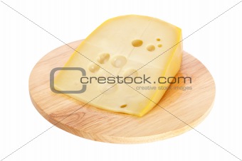 Cheese on wooden dish