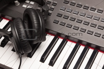 Headphones Laying on Electronic Keyboard with Narrow Depth of Fiel