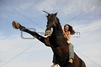 rearing stallion and laughing girl