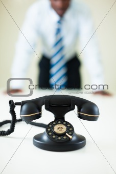 businessman staring at the phone