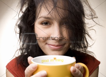 positive girl with yellow cup