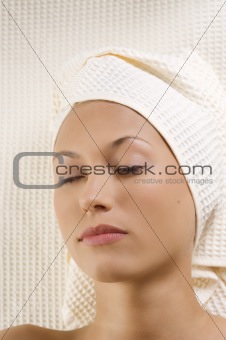 woman in spa with closed eyes