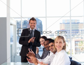 Business people clapping after a presentation