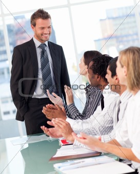 Business people clapping after a presentation