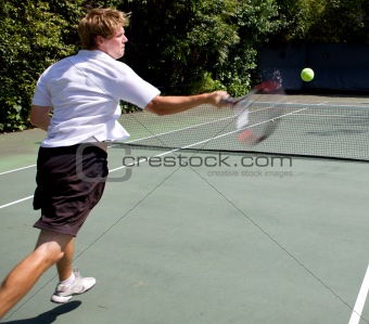 Tennis Player smashing a ball