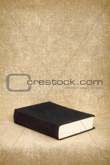 Black book on the fabric background
