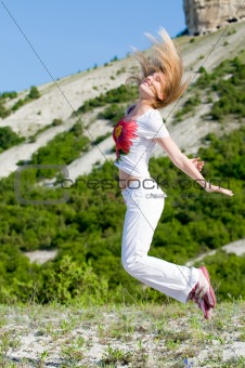 jumping girl in the mountains