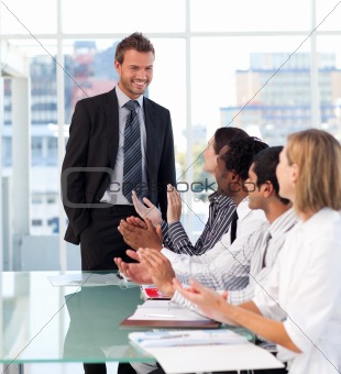Business team applauding his colleague