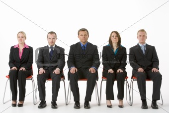 Group Of Business People Sitting In A Line 