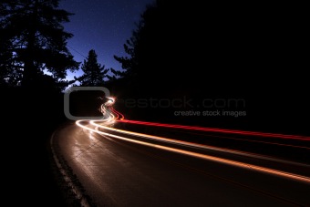 Car Light Trails in the Mountains on a Starry Night