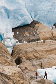 Hikers by glacier