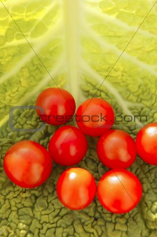 cherry tomatoes and cabbage leaf