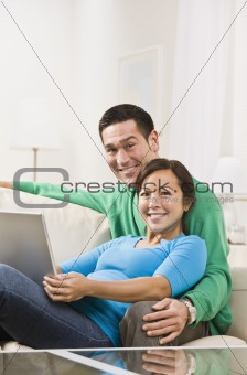 Couple Hugging with Laptop