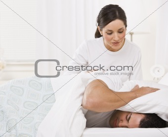 Cute Woman Waking Up her Husband