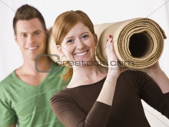 Couple Carrying Carpet Roll