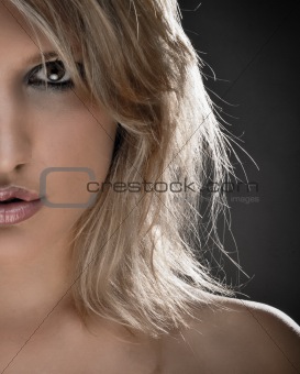 Half Face Portrait Of A Beautiful Blond Woman